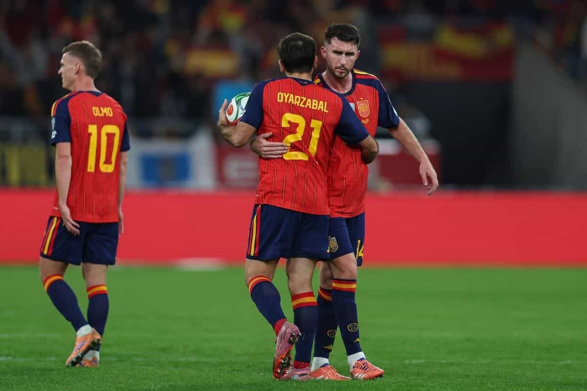 Spain and Switzerland end unbeaten campaigns while Belgium and Romania pick up big wins