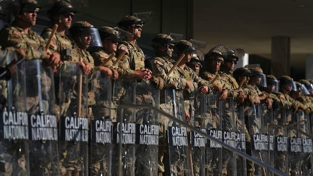 Trump says he is pausing efforts to send the National Guard to Chicago, LA and Portland