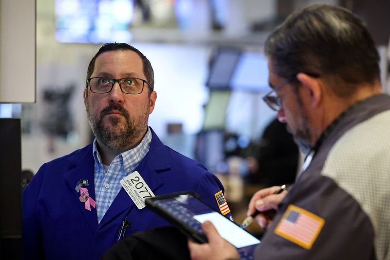 Dow closes above 50,000, Nvidia rises as traders focus on AI spending